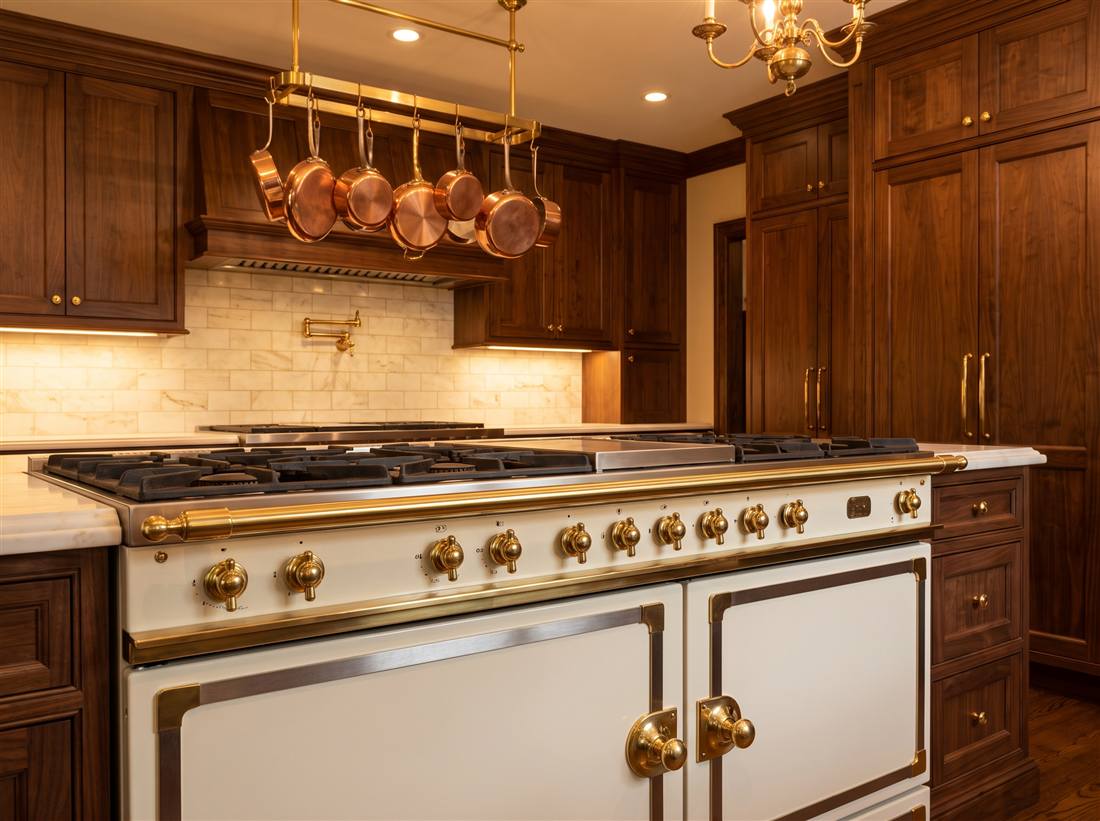 Italian-style luxury range in deep green enamel with brass trim